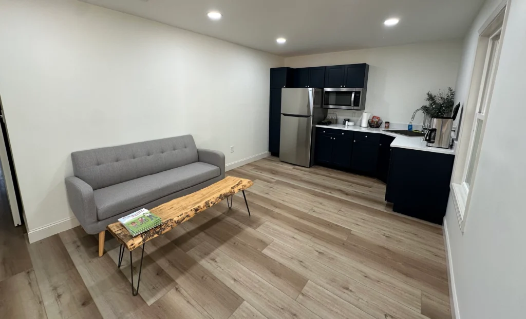 Interior of a retreat cabin at Wings of Eagles Ranch with living area and kitchenette.