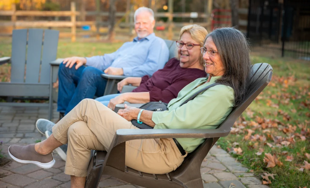 Guests relaxing outdoors during an evening retreat at Wings of Eagles Ranch.
